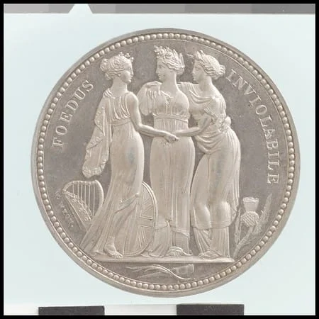 Reverso de moneda de Tres Gracias