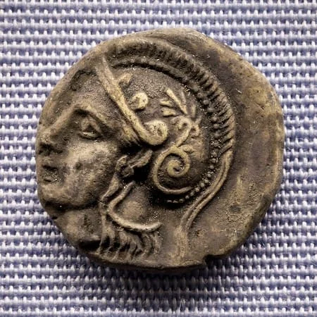 Reverso de moneda de Tritón